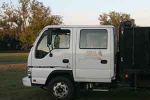 A Landsaping company truck with Landscapes by Land Art  logo